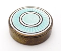 A Continental silver gilt pill / patch box with guilloche enamel detail to lid. Indistinctly marked,