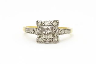 An 18ct gold ring with platinum set diamonds. Ring size approx. M Please Note - we do not make