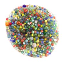 Toys: A quantity of assorted vintage marbles of various sizes, some with colour twists. Largest