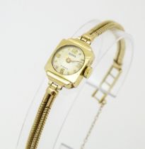 A 9ct gold ladies Bernex watch, with 9ct gold strap. The watch Approx 1/2" wide Please Note - we