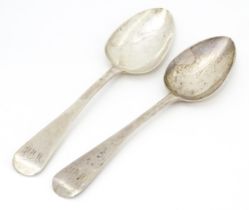 A pair of Geo III silver table spoons hallmarked London 1818, maker TW. Approx. 8 3/4" long (2)