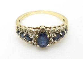 A 9ct gold ring set with sapphires and diamonds. Ring size approx. P Please Note - we do not make