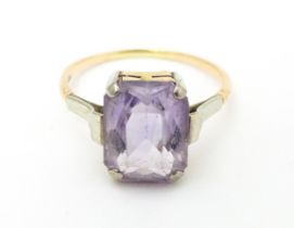 An Art Deco ring set with central amethyst. Ring size approx. P Please Note - we do not make