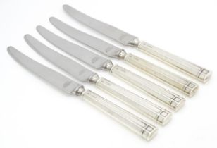 Five silver handled butter / tea knives hallmarked Sheffield 1940, maker H. Hunt. Approx. 6 3/4"