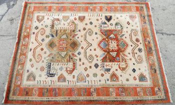 Carpet / Rug : A cream ground rug with dark salmon / terracotta borders, decorated with geometric