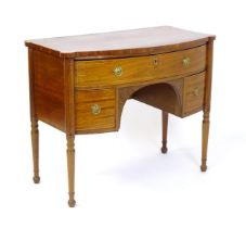 An early 19thC mahogany sideboard, with castellated corners and a single long drawer above two short