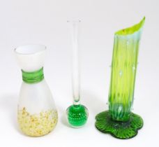 Three items of art glass to include a bud vase and two other vases, one of uranium glass in the