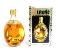 A late 20thC boxed bottle of Haig Dimple Scotch Whisky (26 2/3 Fl Oz) Please Note - we do not make