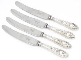 Four silver handled butter / tea knives hallmarked Sheffield 1915, maker Robert Pringle & Sons.