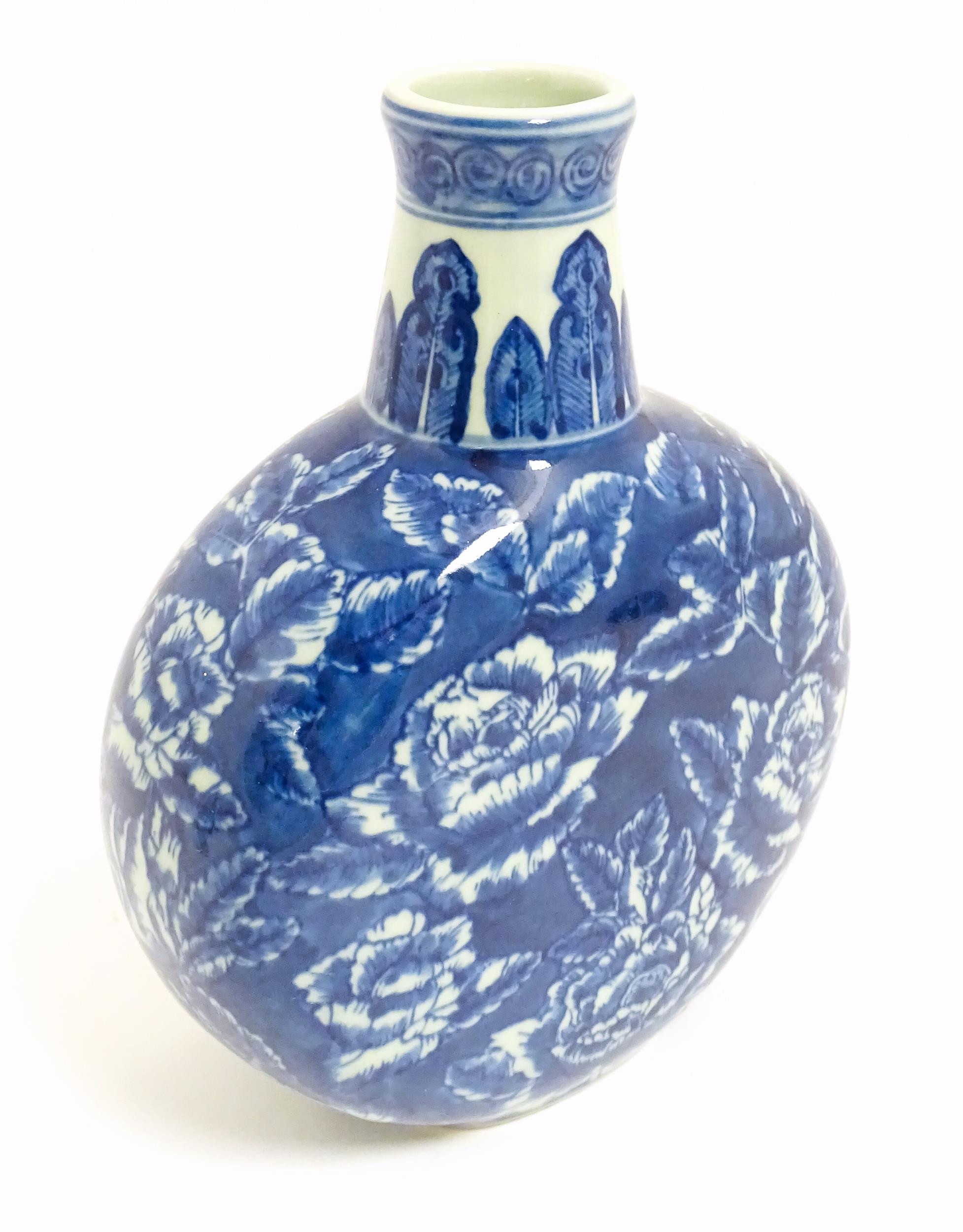 A Chinese blue and white moon vase with floral and foliate decoration. Approx. 10 1/4" high Please - Image 5 of 7