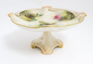 A Royal Worcester blush ivory tazza with rose decoration and gilt highlights. Marked under.