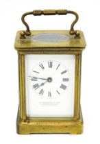 A French 20thC brass cased carriage clock by Duverdry & Bloquel with white enamel dial signed Wm
