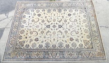Carpet / Rug : A beige ground rug with floral and foliate detail worked in shades of blue. Approx.