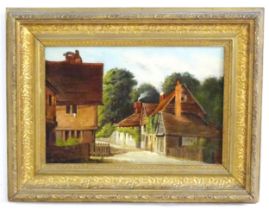 19th century, Oil on canvas, A village street scene. Remains of label verso. Approx. 8 1/4" x 12 1/