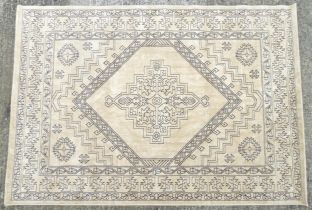 Carpet / Rug : A cream ground rug with dark geometric detail. Approx. 92" x 64" Please Note - we
