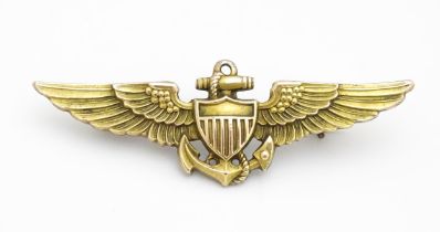 Militaria : a mid 20thC silver gilt United States Navy naval aviator cap badge, the reverse marked