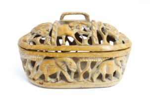 Ethnographic / Native / Tribal: An African carved wood container and cover with reticulated