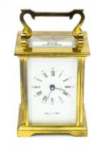 A brass carriage clock, the movement signed Bornand Freres, the front signed with retailers Mappin &