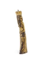 Ethnographic / Native / Tribal : An African carved bone with figural detail. Approx. 9 3/4" high