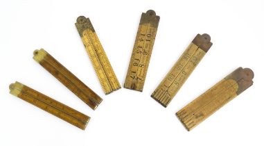 A quantity of 20thC boxwood and brass folding rulers to include examples by Rabone, Stanley Rule &