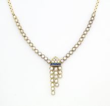 A 14ct gold necklace set with 51 diamonds and a band of 4 sapphires in an Art Deco setting.