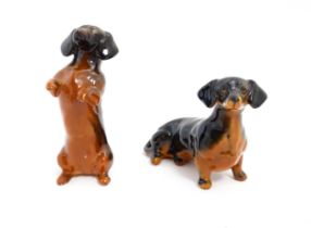 Two Beswick models of Dachshund dogs model no. 1460 & 1461. Largest approx. 4" high (2) Please