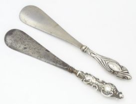 Two silver handled shoe horns, one hallmarked Birmingham 1899 the other Chester 1920. The longest
