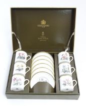 A Royal Worcester coffee set, comprising 6 cups and saucers decorated with botanical decoration