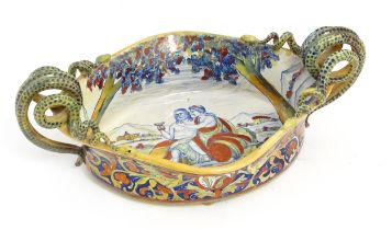 An Italian lustre glazed maiolica bowl / dish with twin snake / serpent handles with hand painted