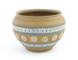 A Royal Doulton Silicon ware jardiniere / planter with banded floral and foliate detail. Marked