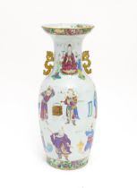 A large Chinese famille rose vase with twin handles, decorated with theatrical Wu Shuang Pu figures,