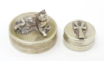 Two Continental silver pill boxes, one surmounted by a model of a cat, bearing silver marks for
