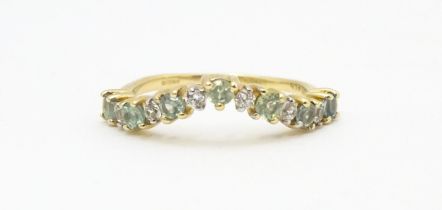 A 9ct gold ring set with green and white stones. Ring size approx. L Please Note - we do not make