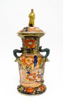 A 19thC Masons Ironstone vase with twin handles of dolphin / serpent form, decorated in the Imari