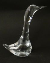 A clear glass model of a goose, signed Daum France. Approx 7 1/2" high Please Note - we do not