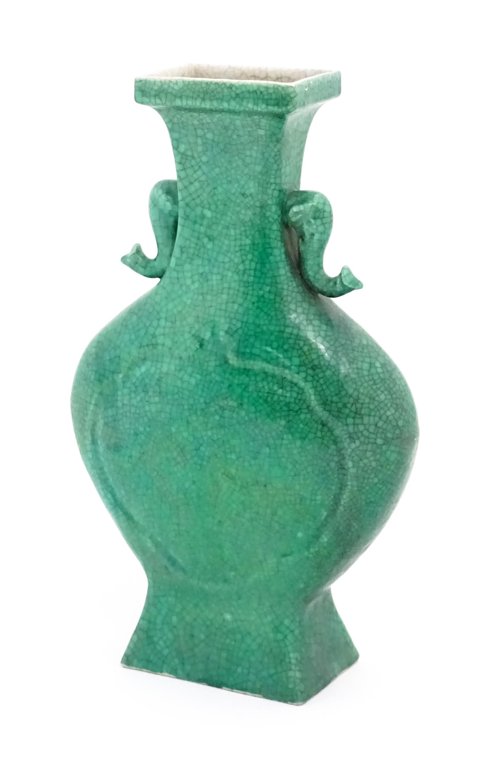 A Chinese vase of shaped form with twin elephant head handles with a green crackle glaze. Approx. - Image 3 of 6