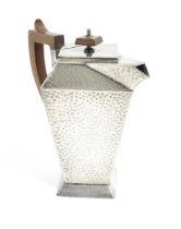 An Arts and Crafts pewter coffee pot of squared form with hammered decoration, and wooden handle and