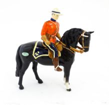 A Beswick Canadian Mountie on a black horse, model no. 1375. Marked under. Approx. 8 1/4" high