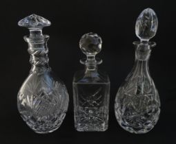 Three various cut crystal / glass decanters. The tallest approx 12 1/4" high (2) Please Note - we do
