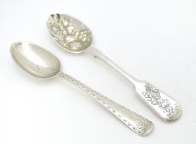 Two silver teaspoons, one Victorian example with bright cut decoration hallmarked London 1877, maker