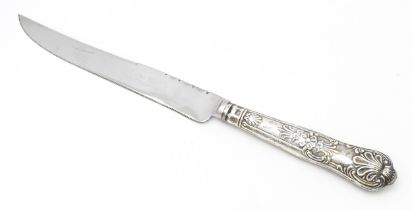 A silver handled King's pattern cake knife, hallmarked Sheffield 1972, maker Harrison Brothers.