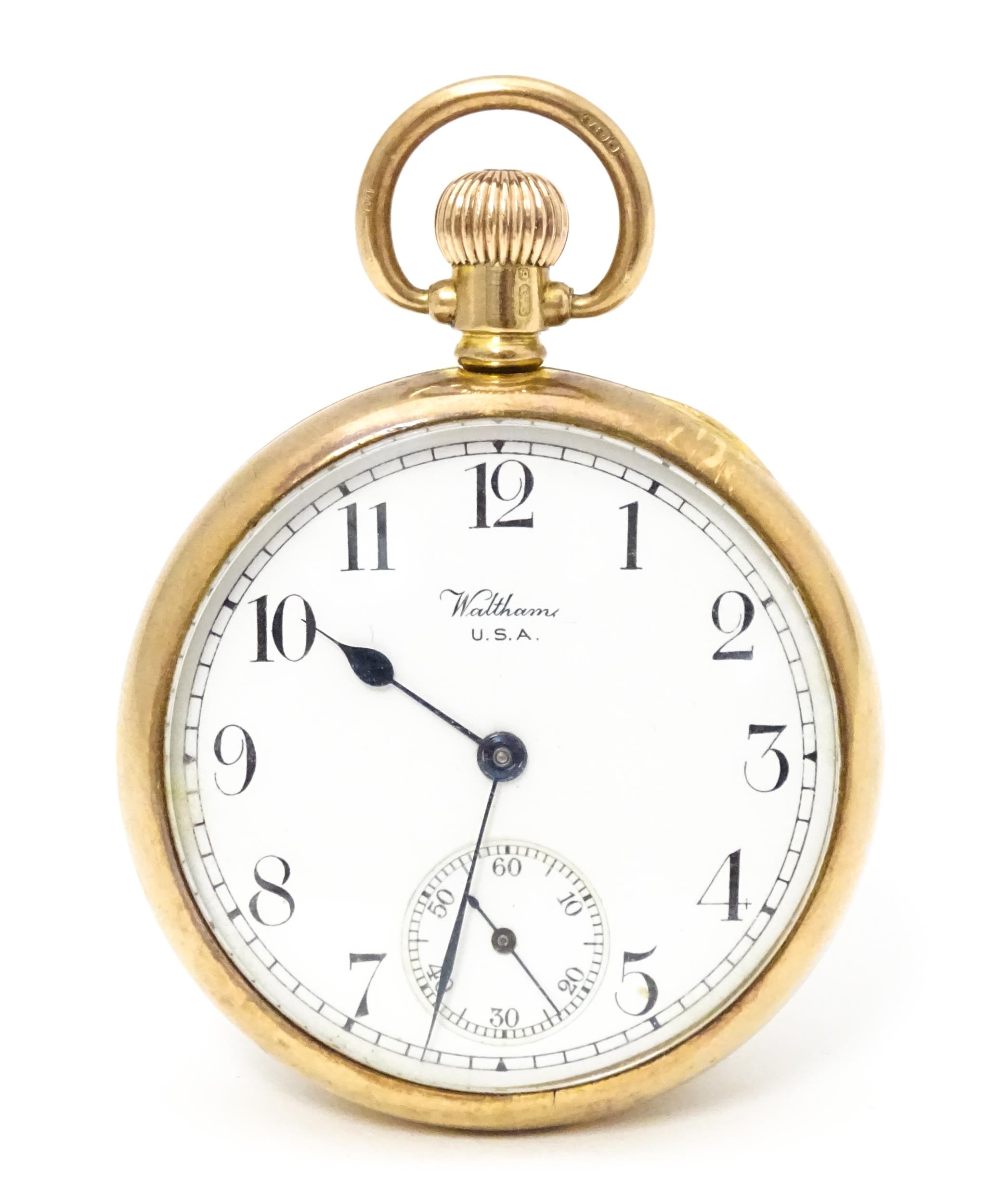 A Waltham USA 9ct gold cased open face pocket watch, the white enamel dial with Arabic numerals