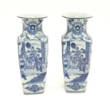A pair of Chinese blue and white vases decorated with Imperial figure and attendants on a terrace,