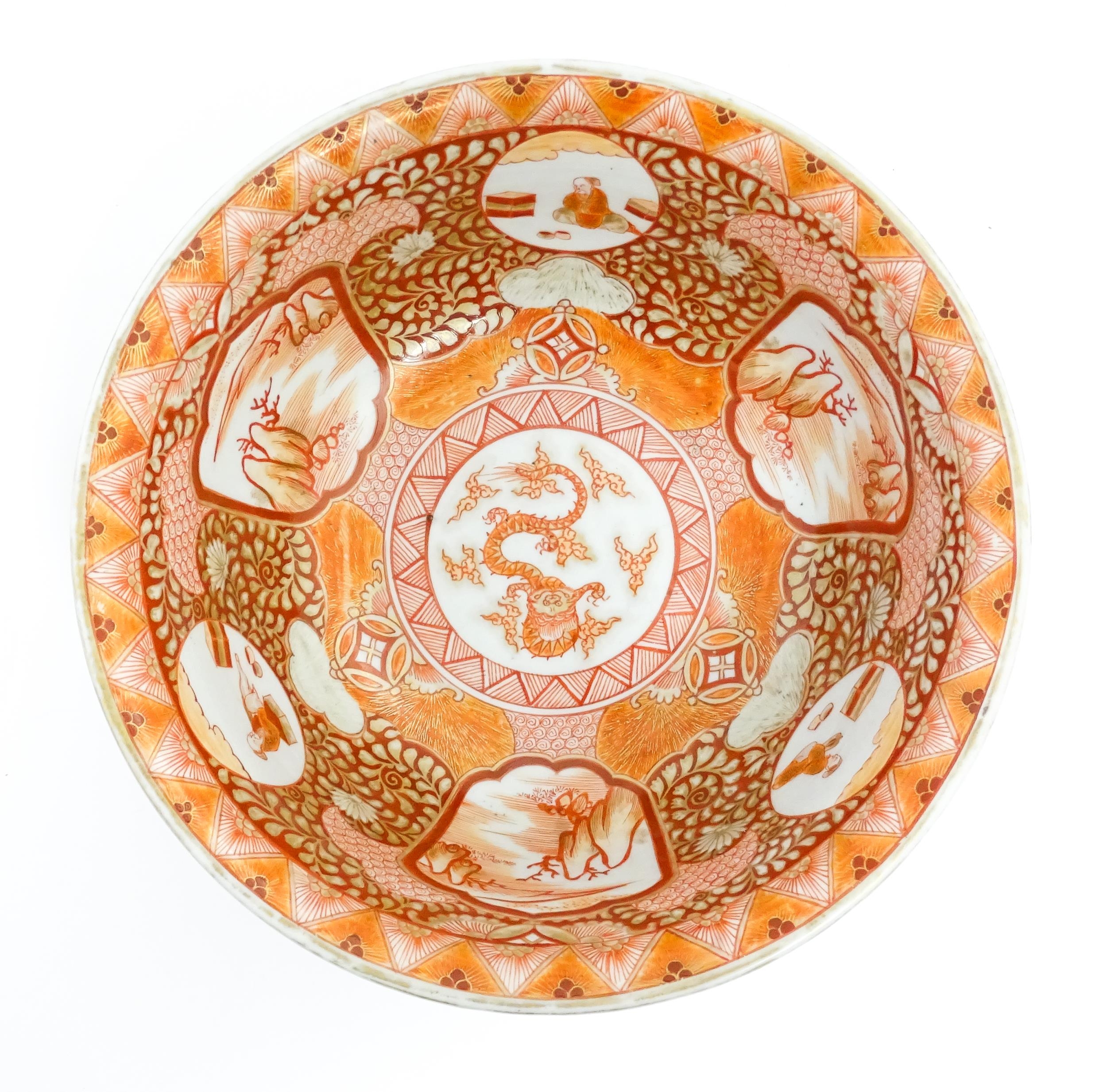 An Oriental bowl decorated in the Kutani palette with central dragon motif, the sides with landscape - Image 6 of 6