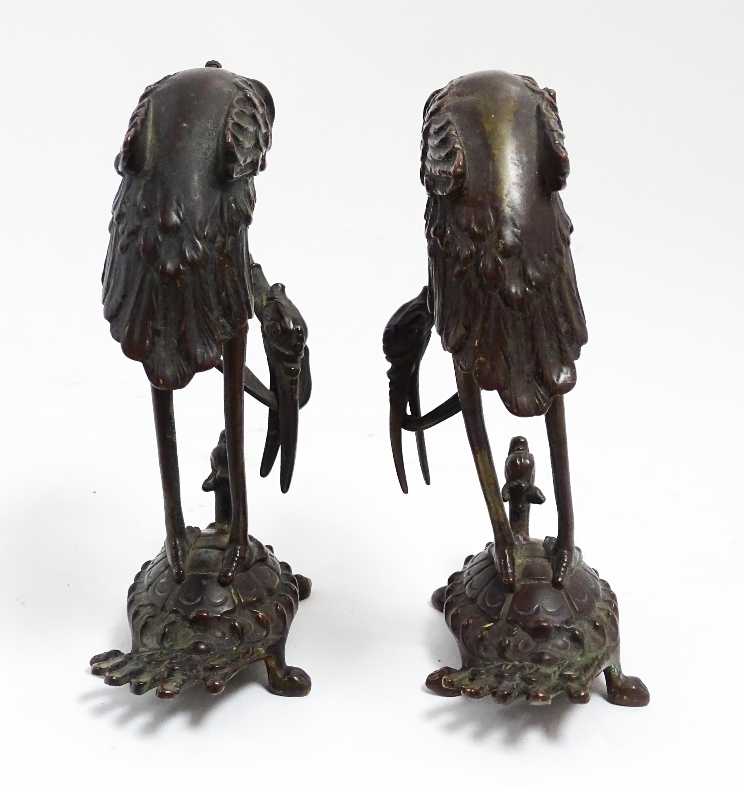 A pair of Japanese cast sculptures modelled as a stylised crane standing on a tortoise. Approx. 7 - Image 5 of 6