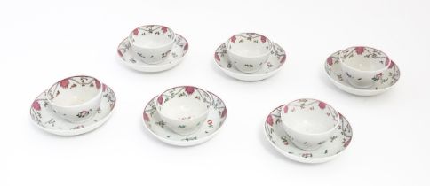 Six New Hall style tea bowls and saucers decorated with flowers and swag detail. Saucers approx. 5