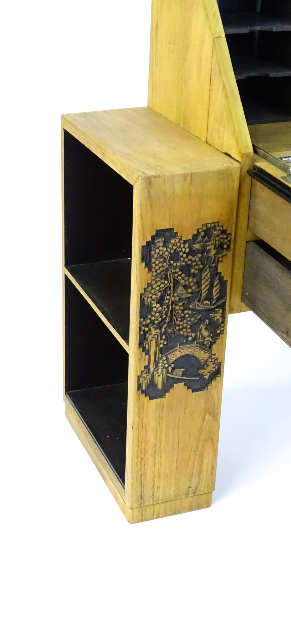 An early / mid 20thC Teak bureau accompanied by a stool, with carved oriental scenes to the front, - Image 3 of 12