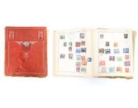 A Strand stamp album to include 19thC and later worldwide postage stamps, including George V Hong