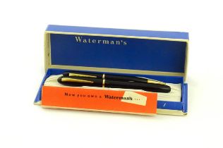 A 20thC boxed Waterman's Champion 501 black fountain pen with 14ct gold W-2B nib, matching