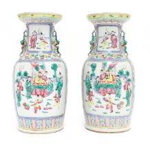 A pair of Chinese famille rose vases with twin animal handles, with panelled decoration depicting